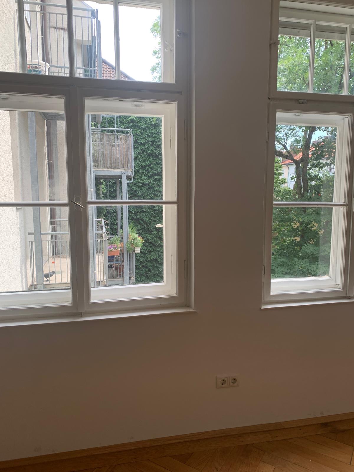 Dega residential cleaning — Living room · Courtyard view